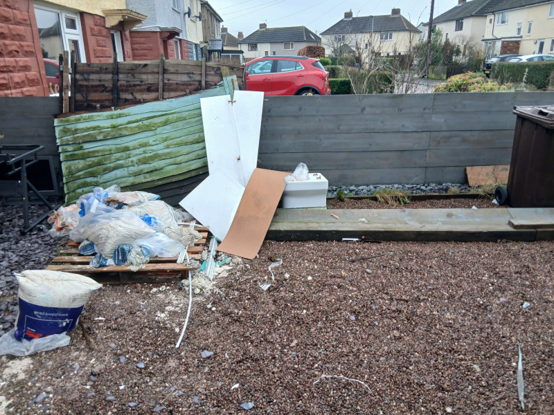Front yard with rubbish