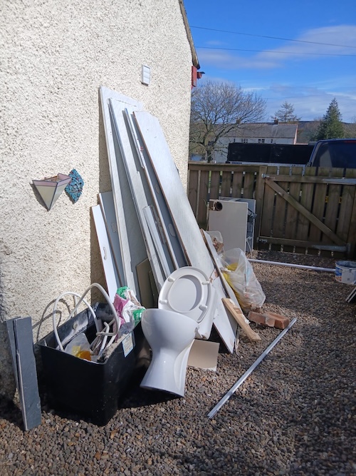 bathroom renovation waste in garden